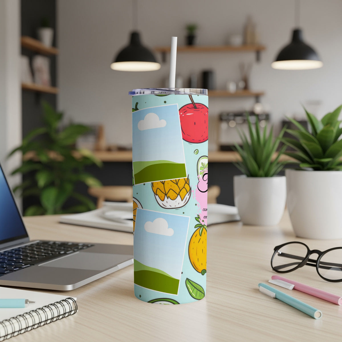 Tumbler with light blue background and colorful fruit illustrations, including an apple and pineapple.