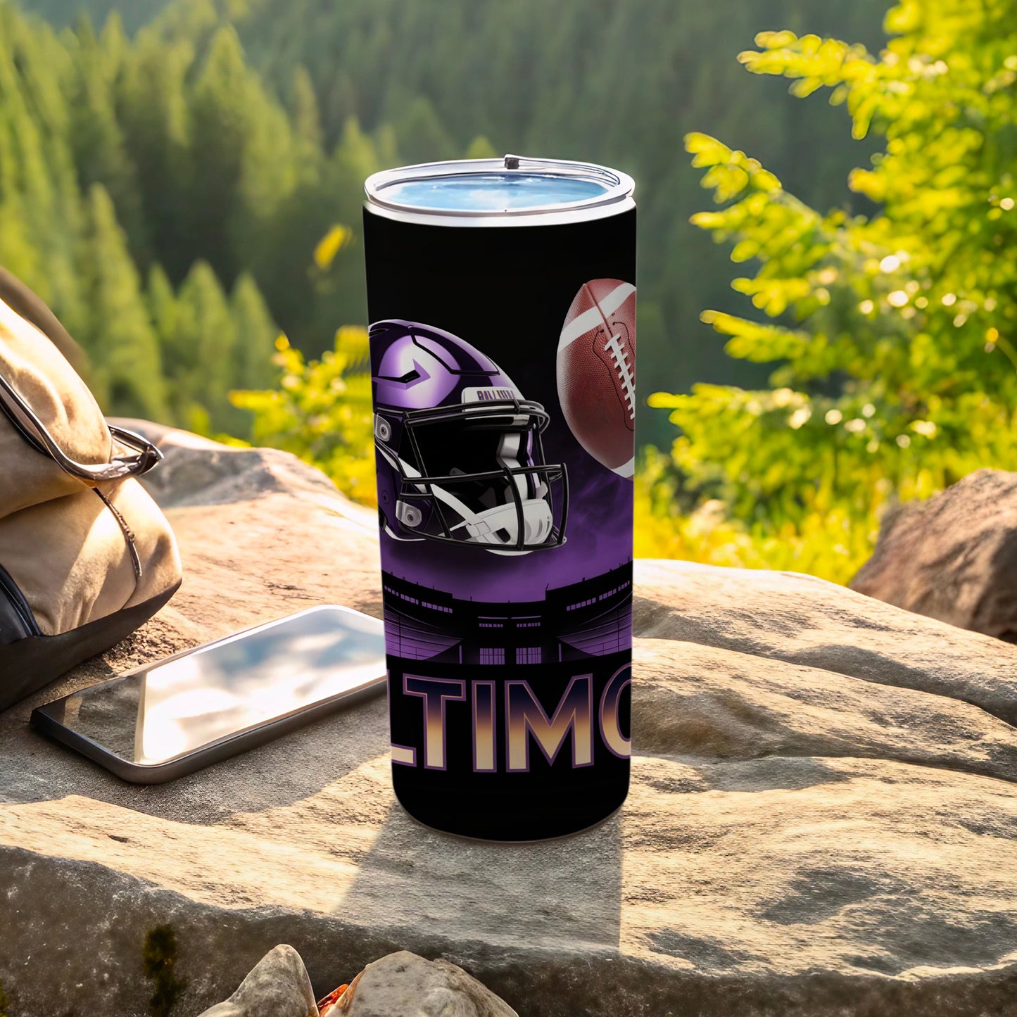 Black tumbler with purple Baltimore Ravens helmet and football design.