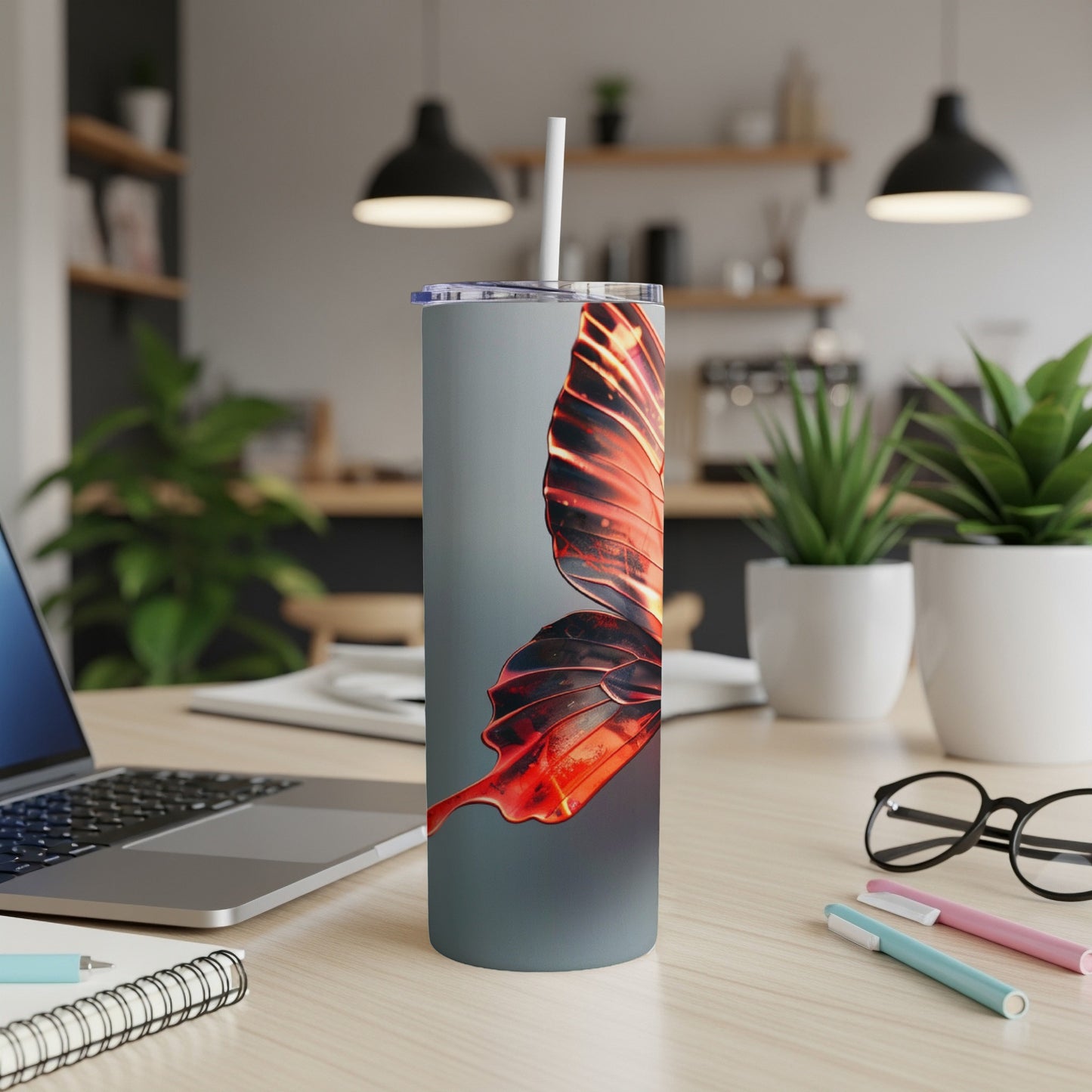 Gray tumbler with close-up of glowing red butterfly wing.