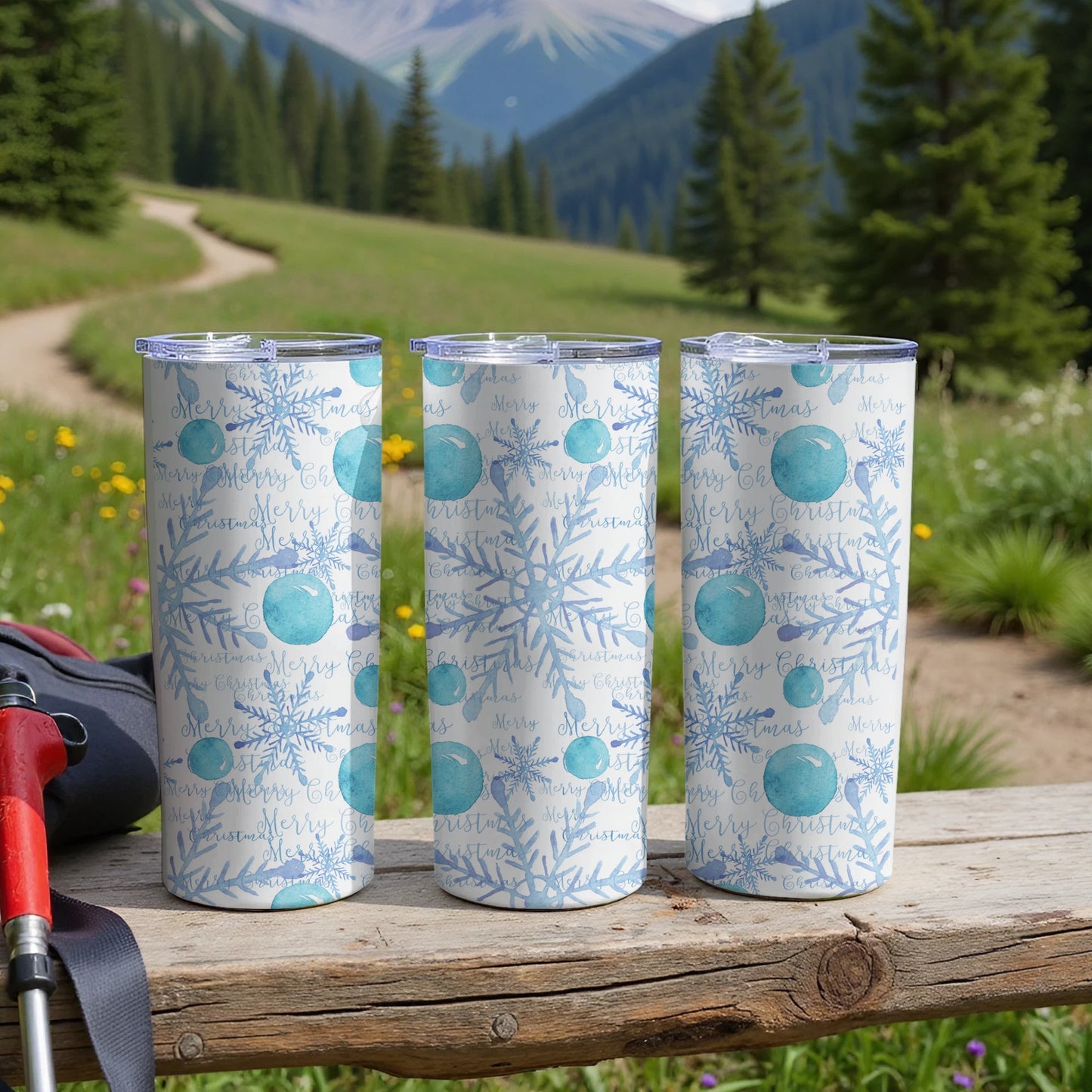 Three blue tumblers with snowflakes and "Merry Christmas" text.