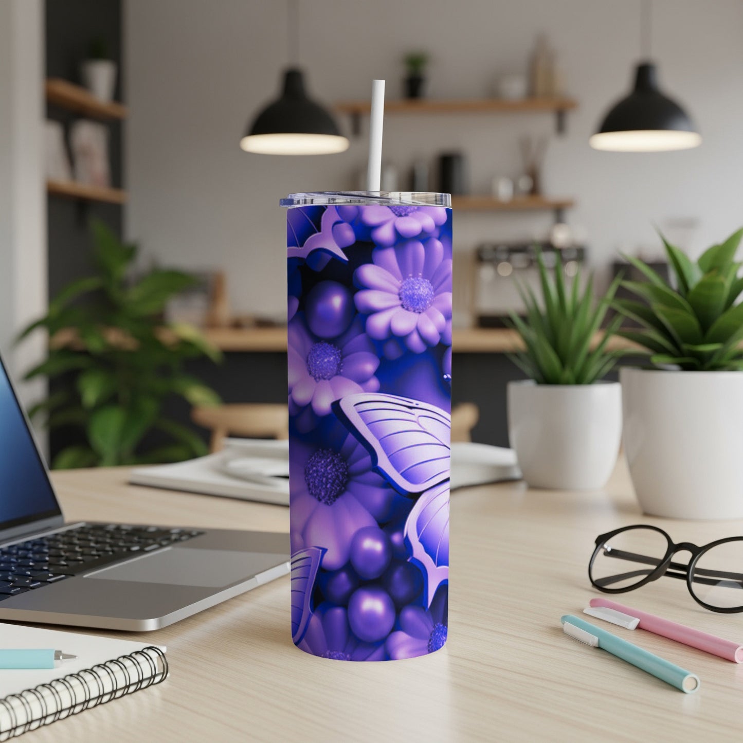 Purple floral and butterfly pattern on a stainless steel tumbler with a straw.