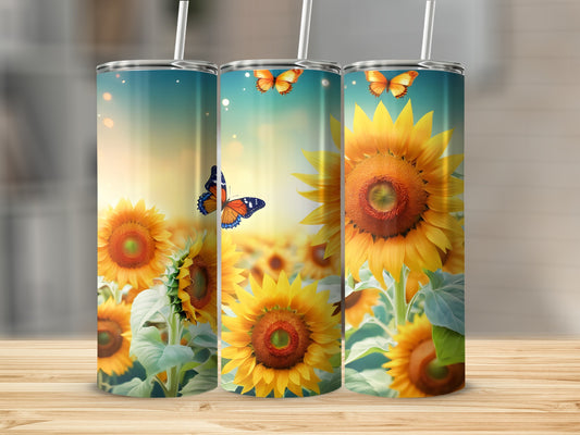 Three tumblers with sunflowers and butterflies, displayed on a wooden surface.