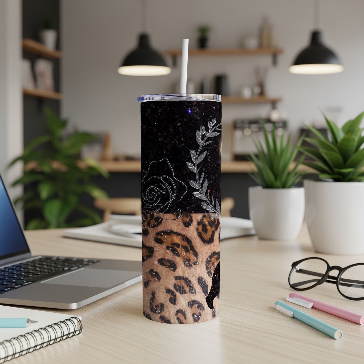 Leopard print tumbler with a black starry top and floral outline.