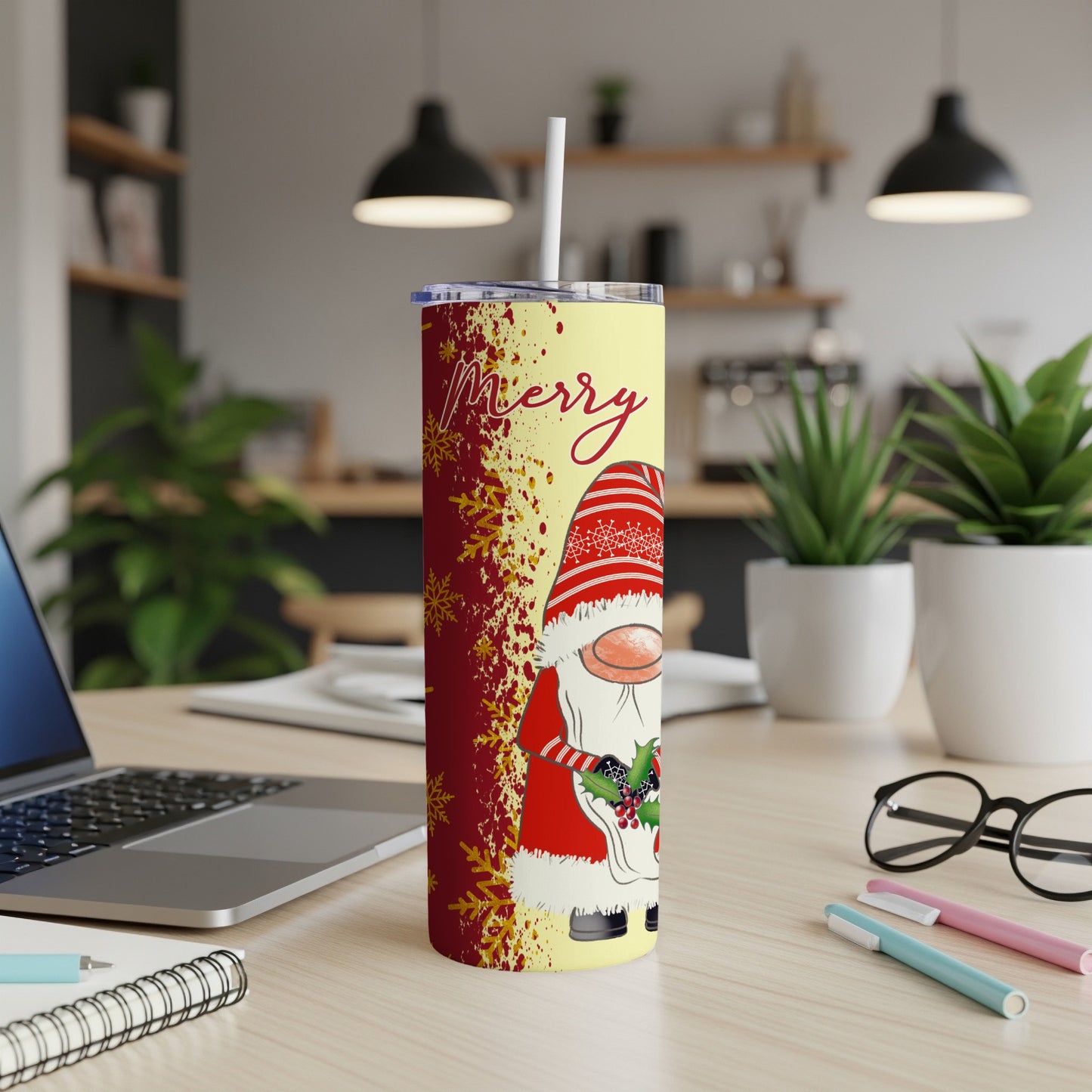 Yellow tumbler with a gnome and snowflakes design, "Merry" text.