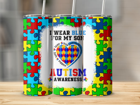 Autism awareness tumbler with puzzle pieces and "I wear blue for my son" text.