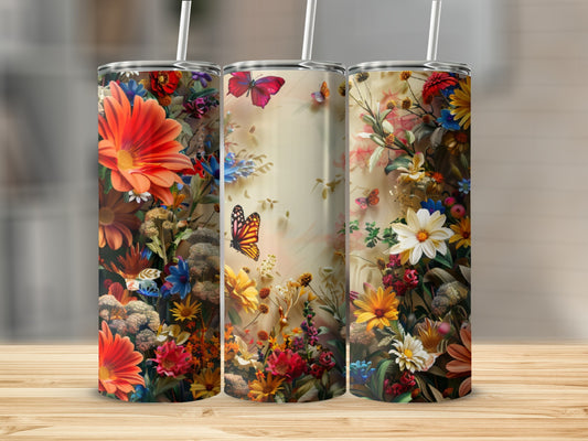 Three tumblers with colorful floral and butterfly designs.