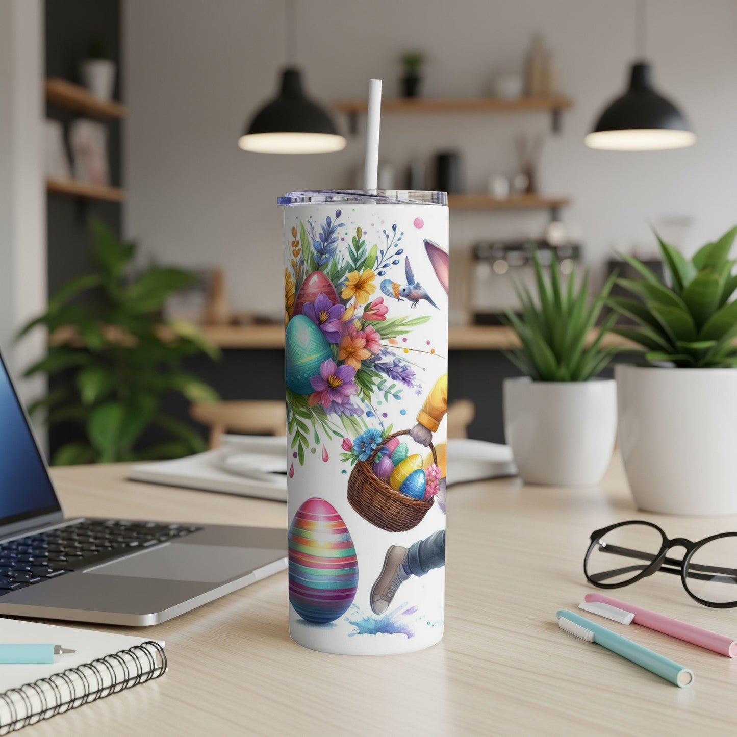Easter tumbler with colorful eggs, flowers, and a basket.