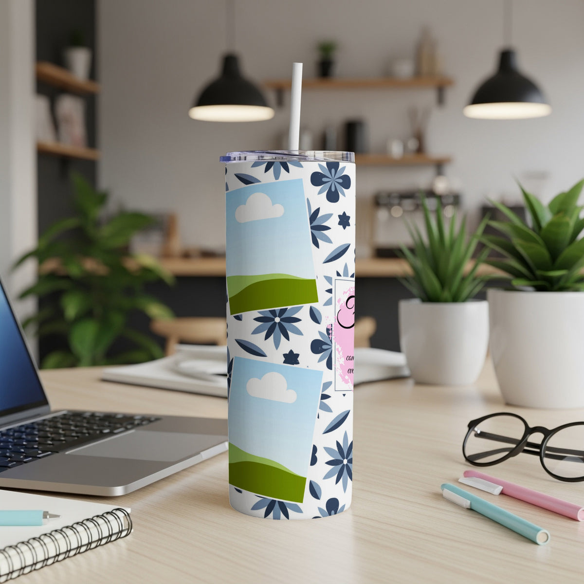 Tumbler with floral pattern, sky photos, and pink graphic with text.