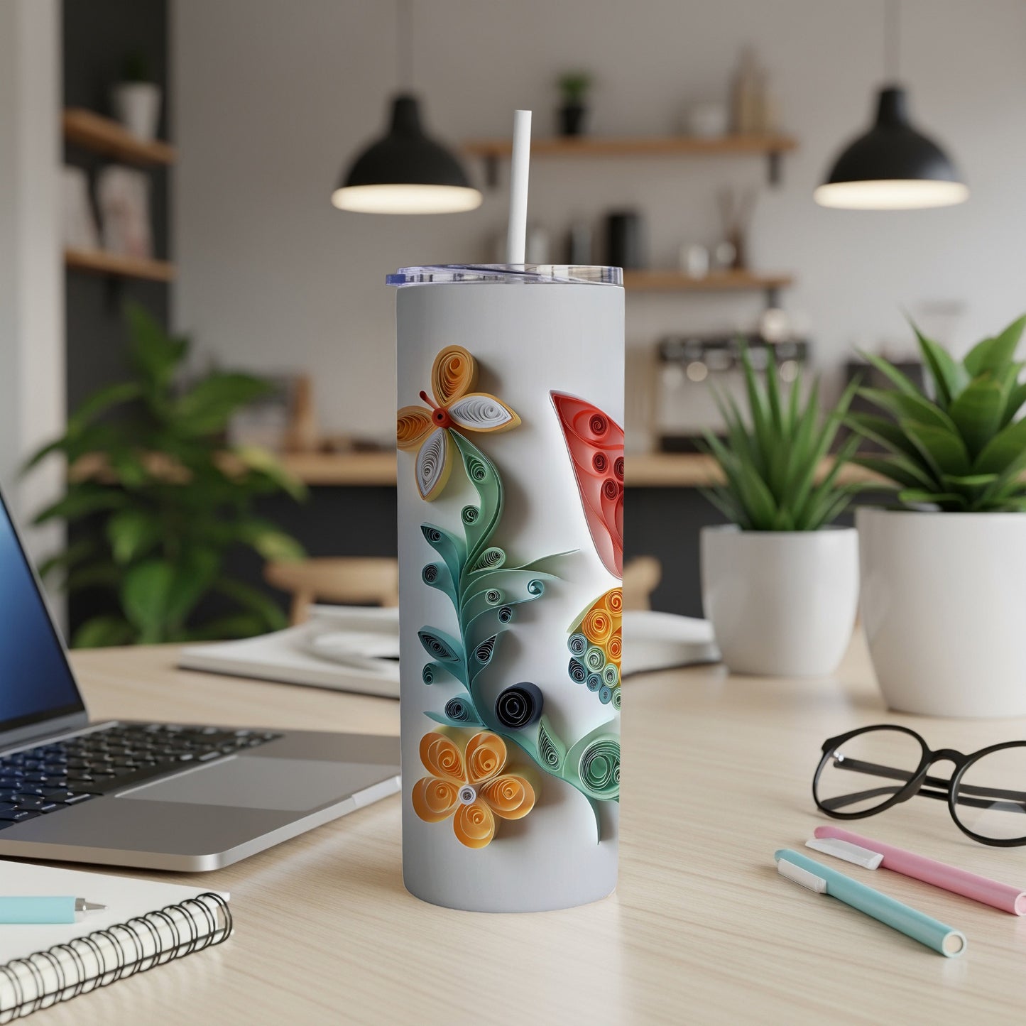 White tumbler with colorful quilled paper floral and butterfly design.