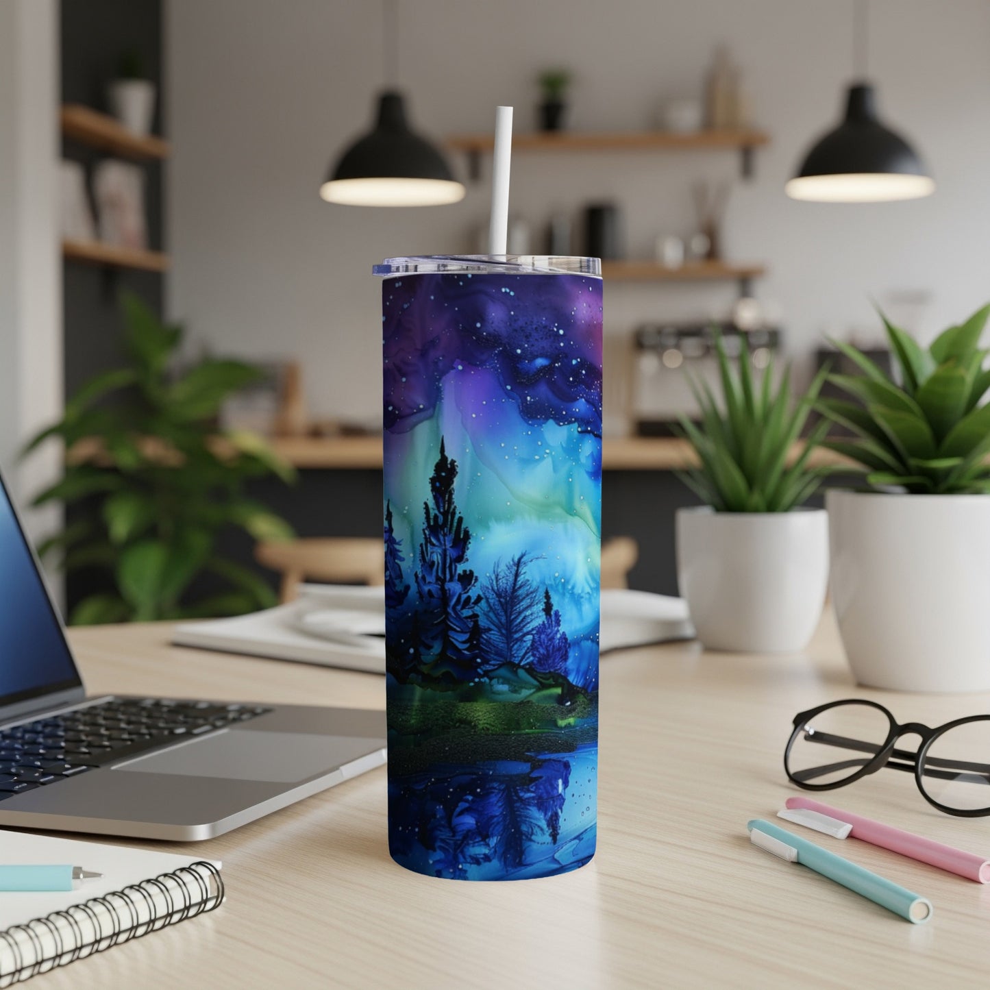 Tall tumbler with a vibrant starry night sky and silhouetted trees reflecting in water.