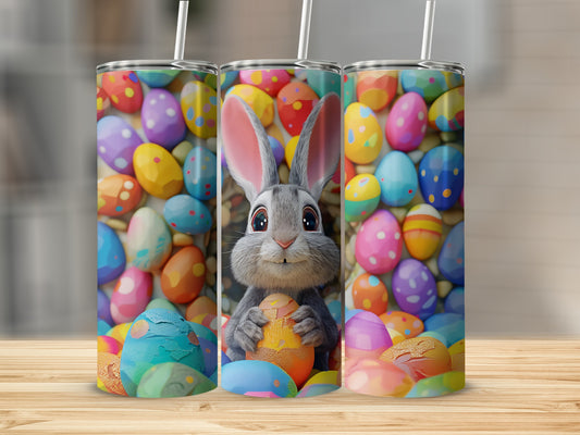 Bunny holding an Easter egg in front of colorful decorated Easter eggs.