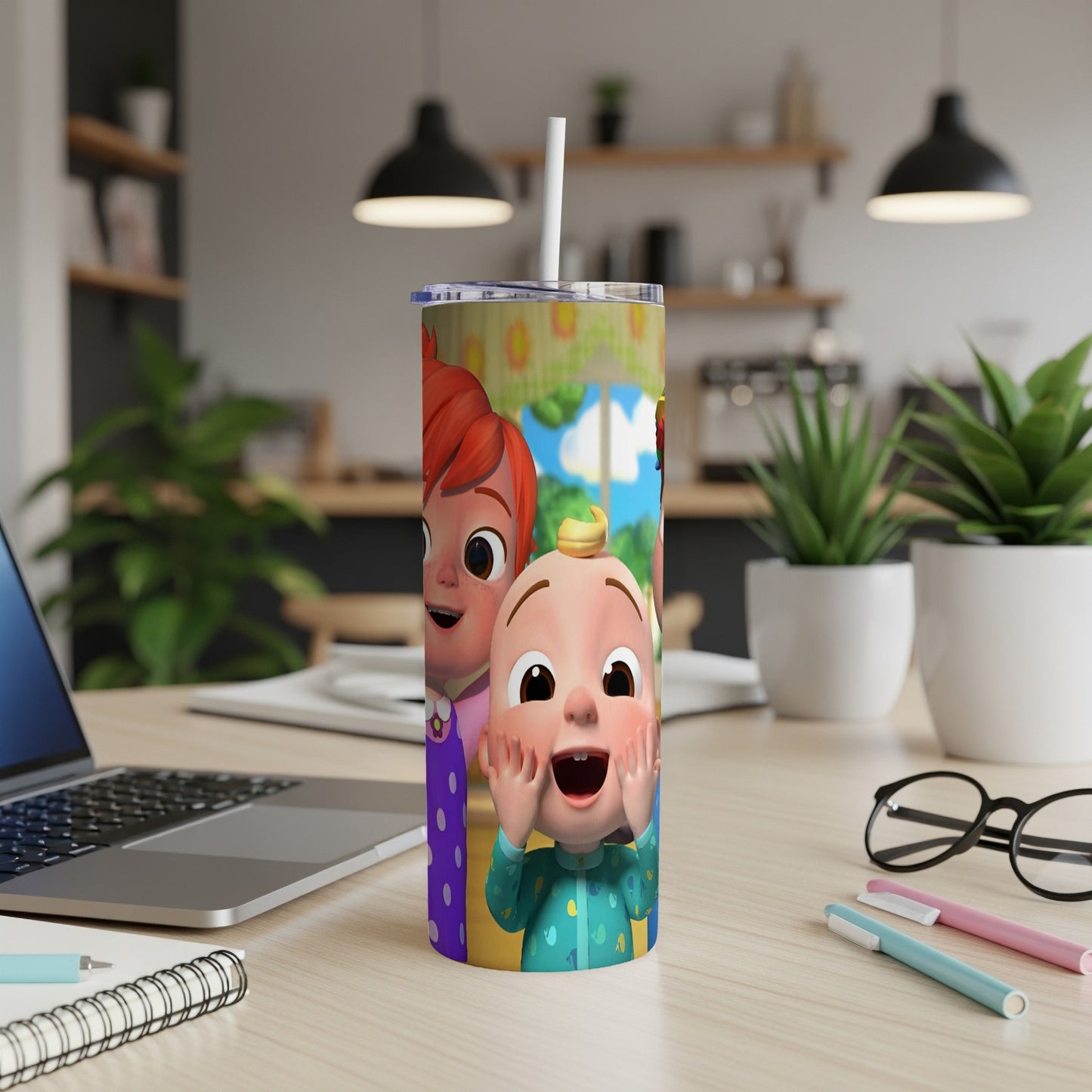 Cocomelon characters JJ and Cody on a colorful skinny tumbler with a straw.