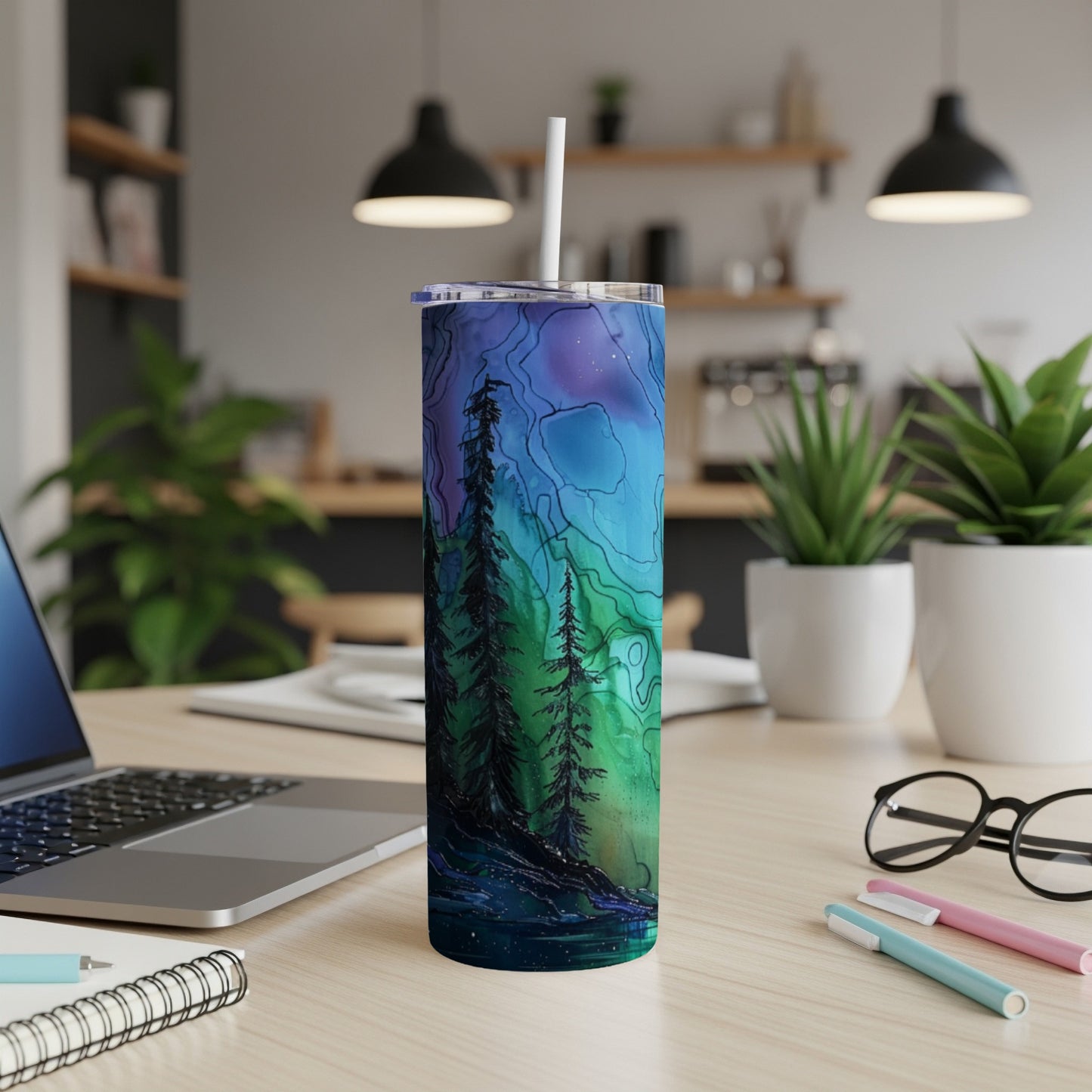 Tall tumbler with a watercolor forest and northern lights design.