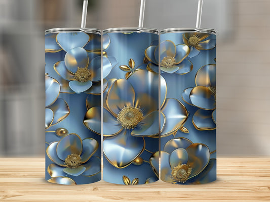 Blue and gold floral patterned tumblers with straws on a wooden surface.
