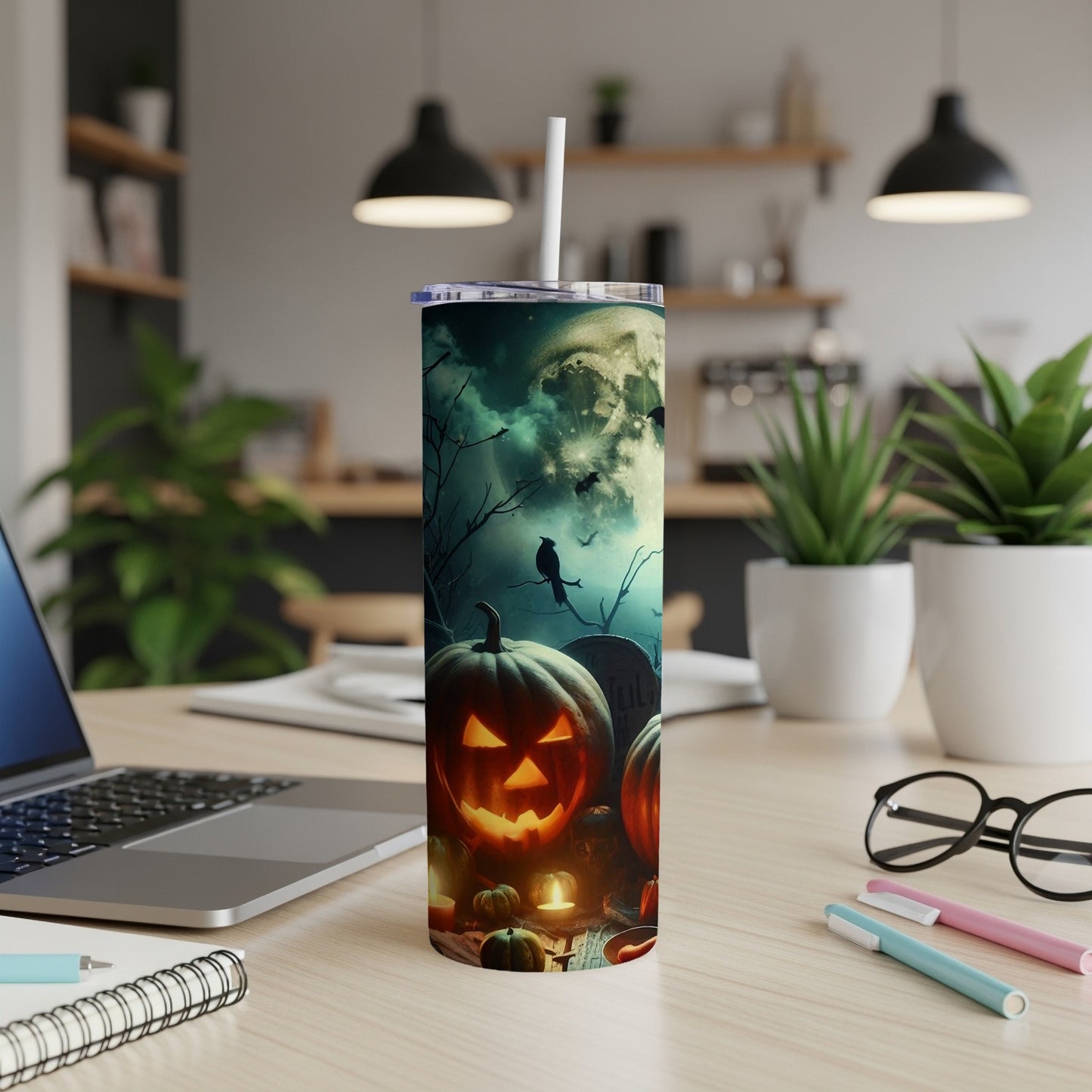 Tumbler with Halloween design of glowing jack-o'-lanterns, bats, and a full moon.