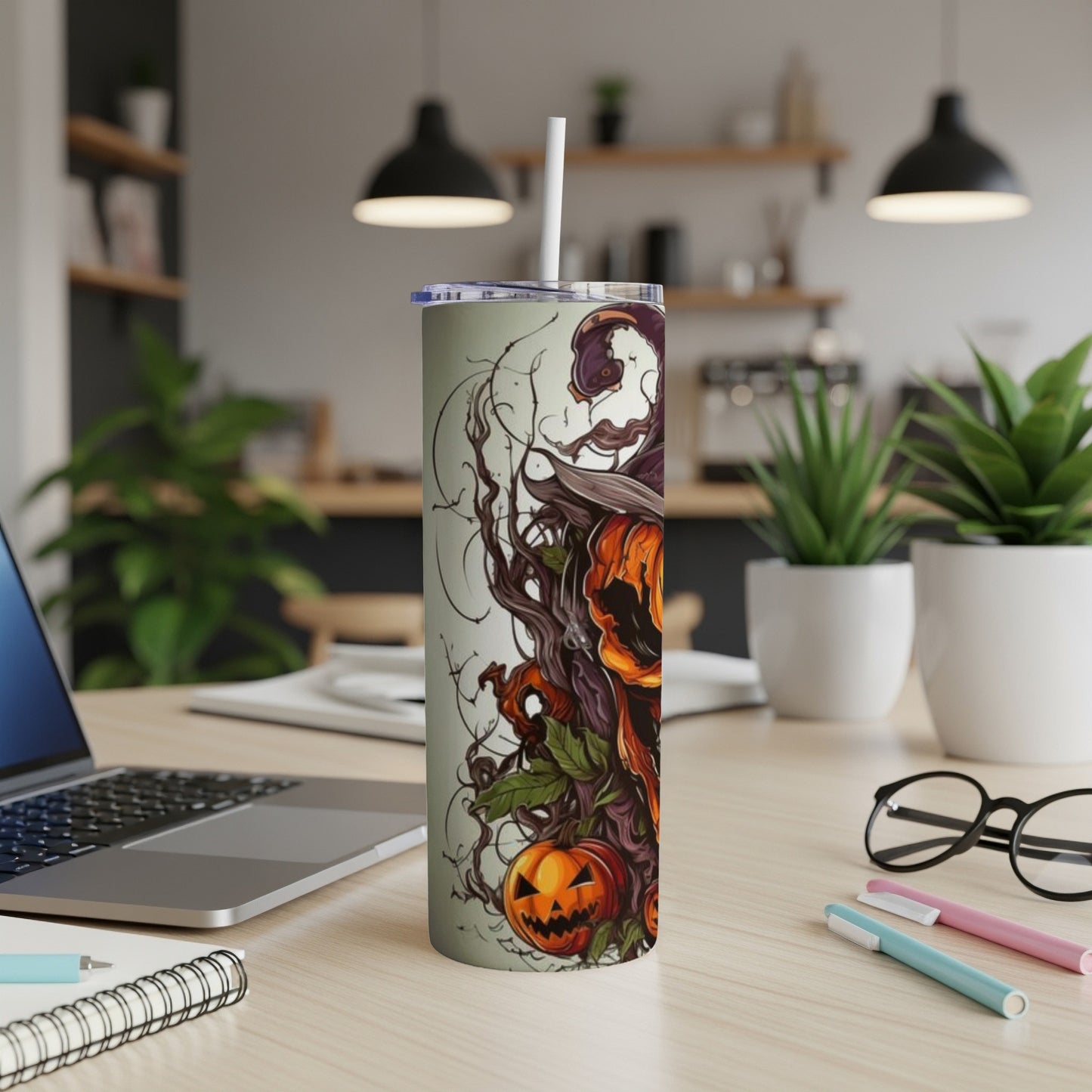 Halloween themed tumbler with pumpkins, witches hat, and branches design.