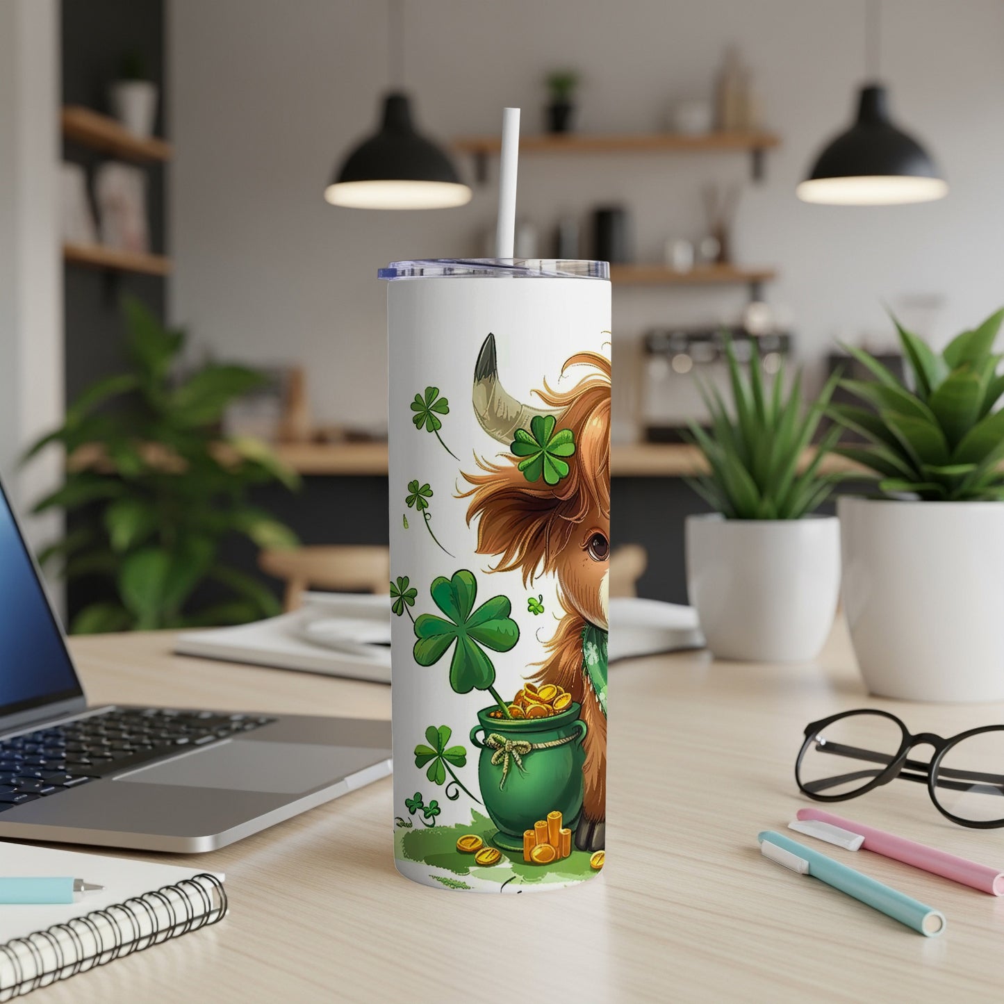 Highland cow with clover and gold coins on a St. Patrick's Day tumbler.