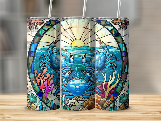Stained glass style tumbler with blue crabs, coral, and sunset ocean scene.