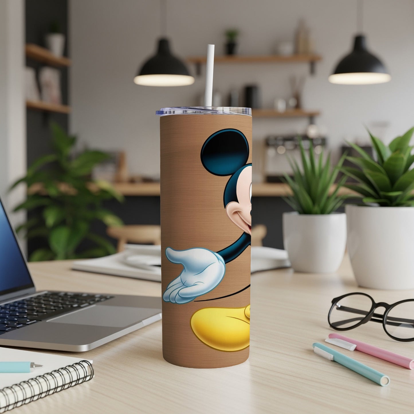 Mickey Mouse on a brown woodgrain tumbler with a straw.