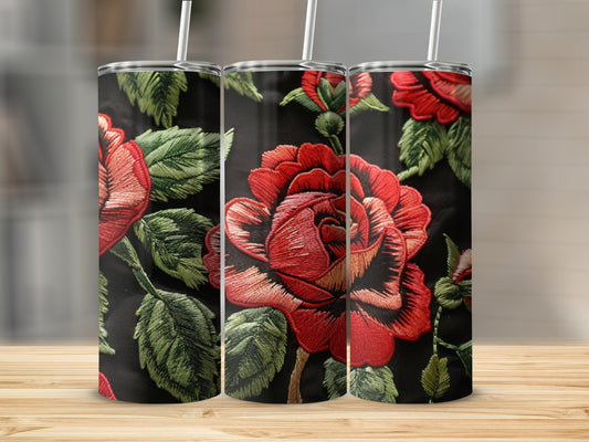 Three tumblers with embroidered red roses and green leaves on a black background.