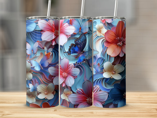 Three tumblers with floral and butterfly patterns on a wooden surface.
