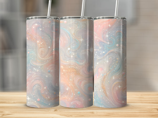 Three tumblers with pastel swirls and glitter pattern on a wooden surface.