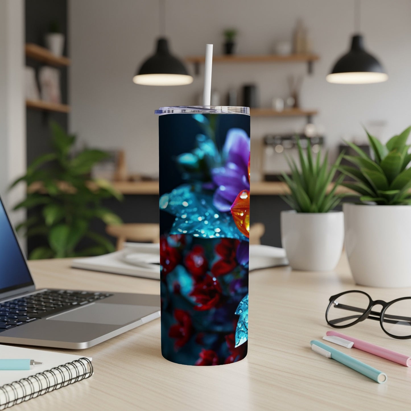 Tumbler with colorful floral pattern featuring blue butterfly.