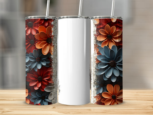 Three tumblers with floral patterns and glitter on a wooden surface.