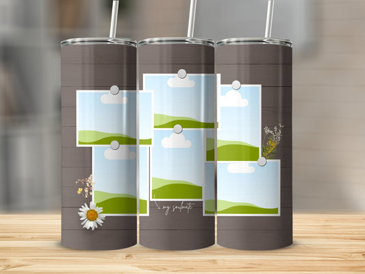 Tumbler with a collage of landscape photos and a daisy graphic, featuring the text "my soulmate."