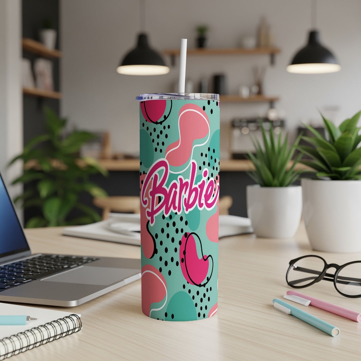 Barbie tumbler with pink, teal, and black abstract pattern.