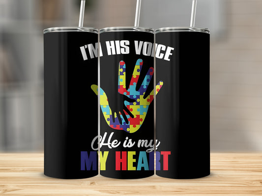 Black tumbler with colorful puzzle hand and text "He is my HEART".