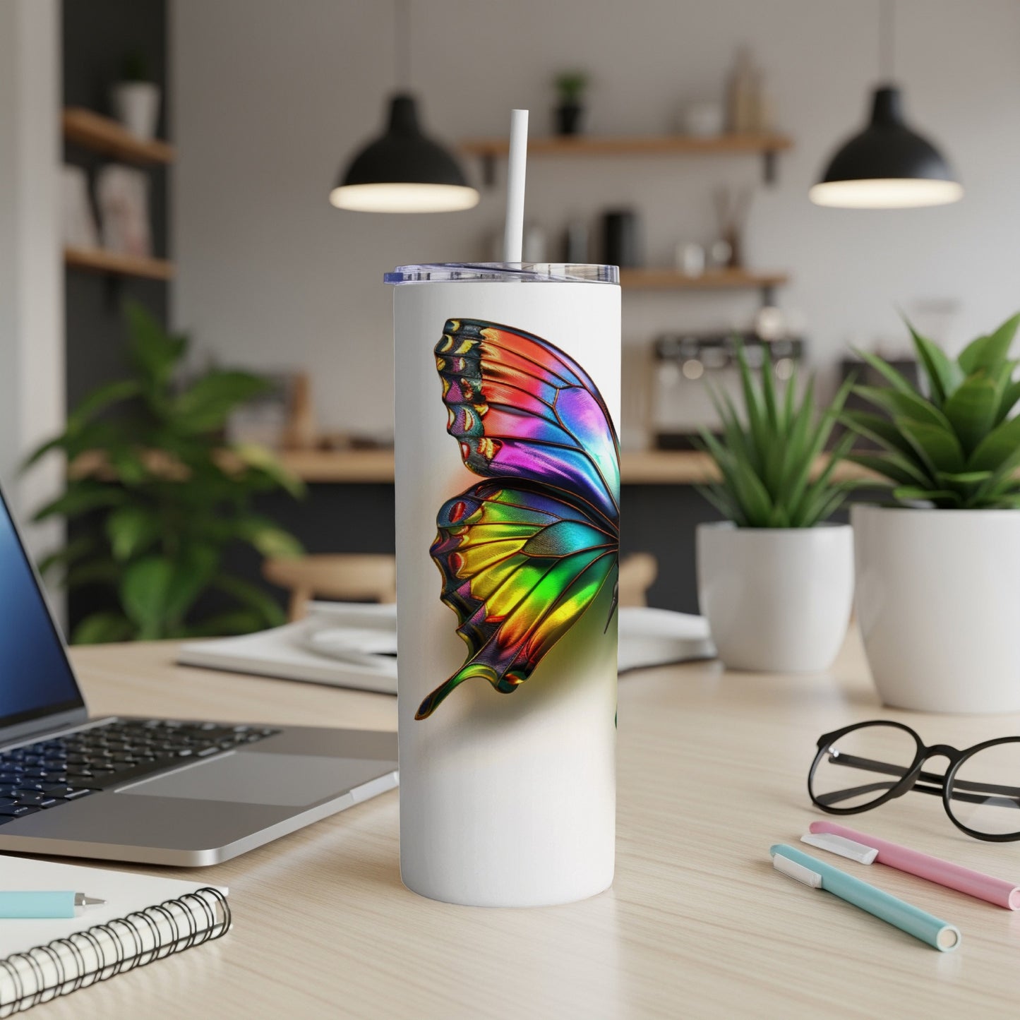 White tumbler with a vibrant, iridescent butterfly design.