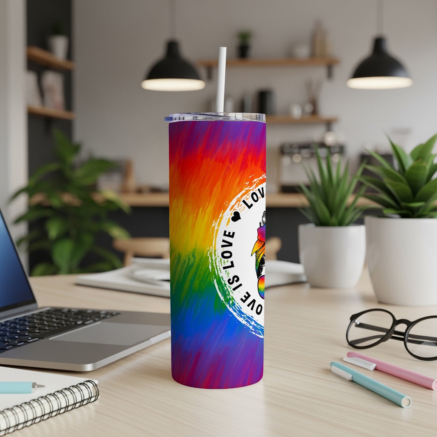 Rainbow tie-dye tumbler with "Love is Love" logo and straw.