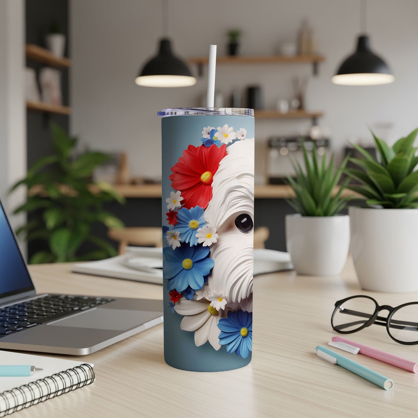 West Highland White Terrier with red and blue floral design on a tumbler.