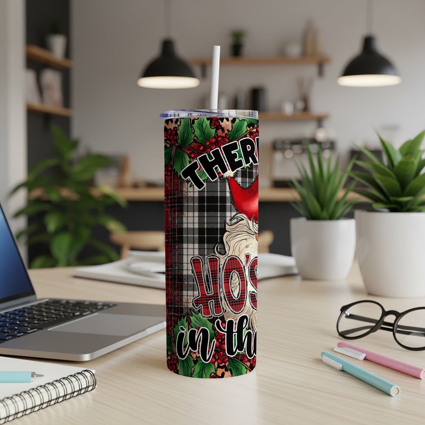 Thermos with buffalo plaid pattern and Santa hat, "Holy" text.