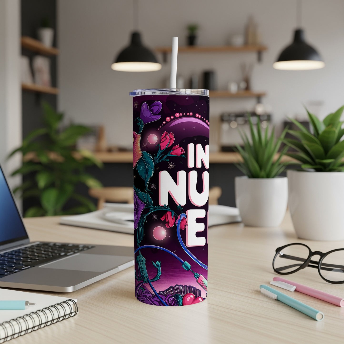 Purple tumbler with "IN NUSE" text and floral, alien-like design.