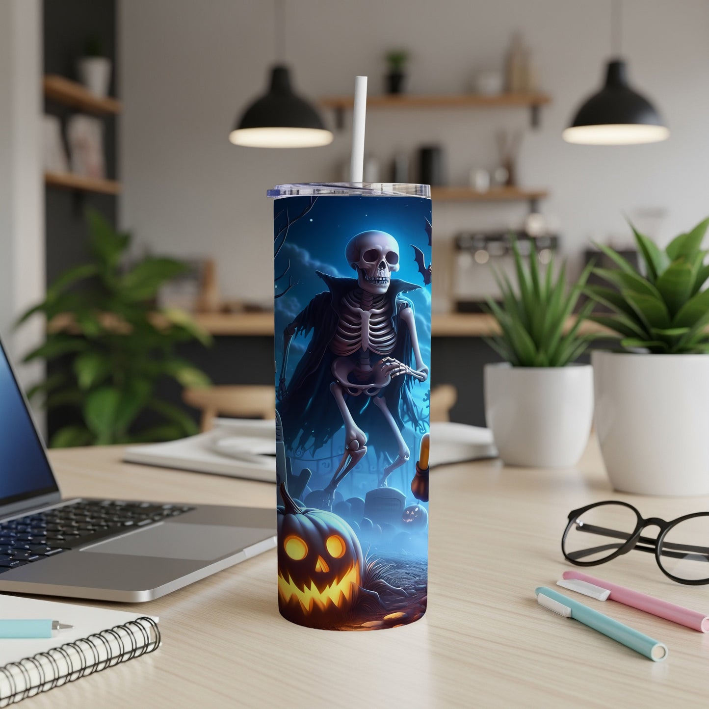 Tumbler with a spooky skeleton and jack-o'-lantern Halloween graphic.