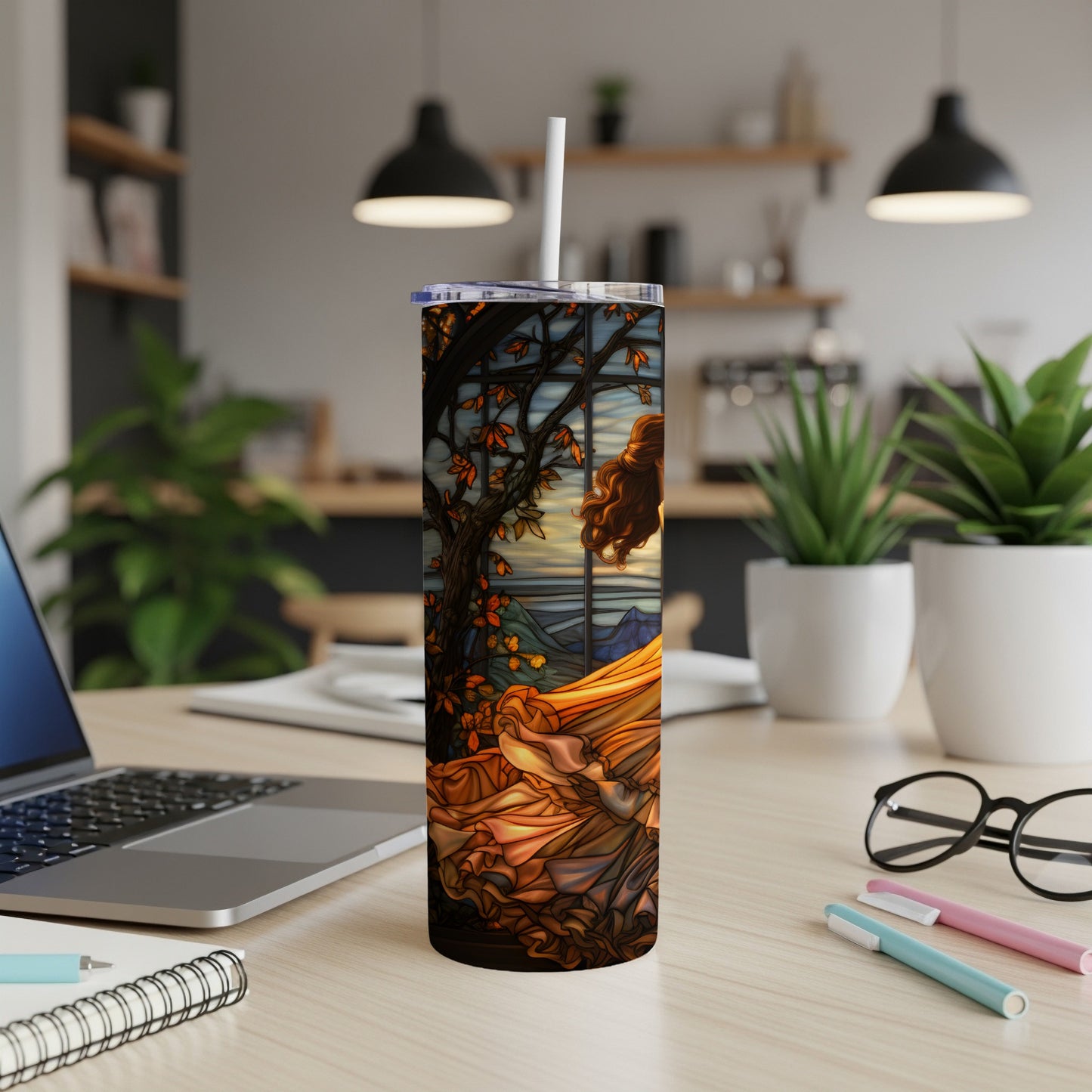 Stained glass-style tumbler with woman in flowing dress and autumn scenery.