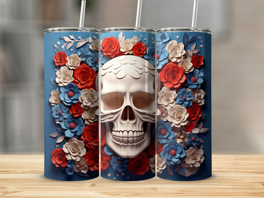 Blue tumbler with skull and floral design.