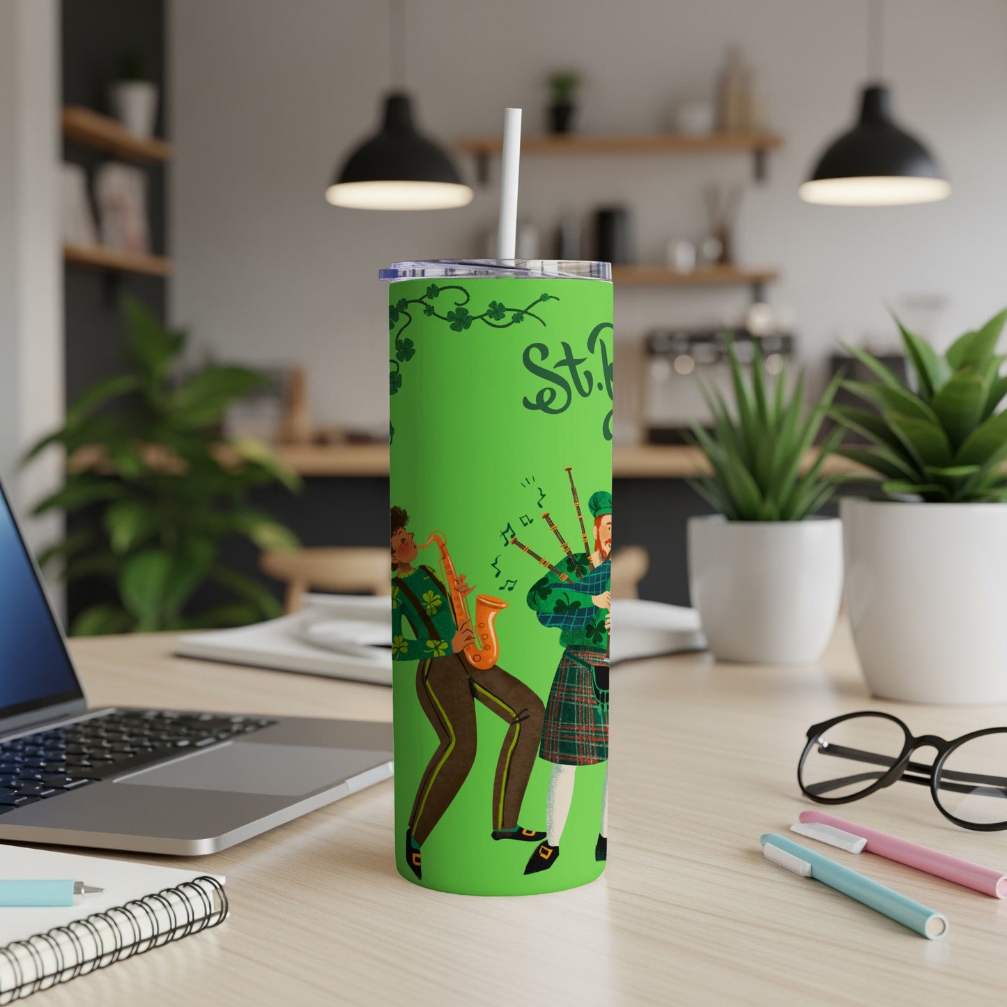 Green tumbler with St. Patrick's Day themed musical illustration.
