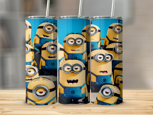 Three Minions characters in blue overalls on a cylindrical tumbler.