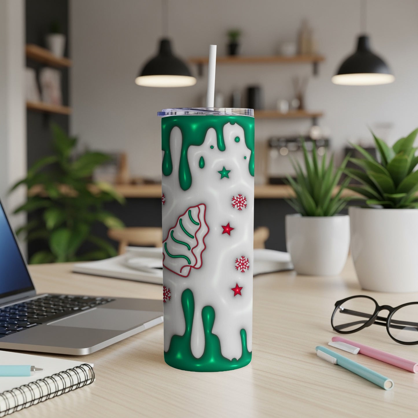Green and white Christmas tree tumbler with snowflakes.