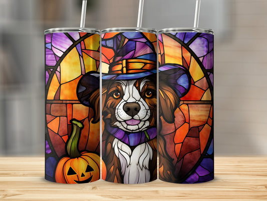 Dog in witch hat with pumpkin, stained glass background.