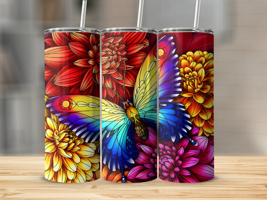 Butterfly and flowers tumbler design on a wooden surface.