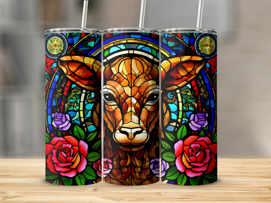 Stained glass cow with roses tumbler design on wooden surface.