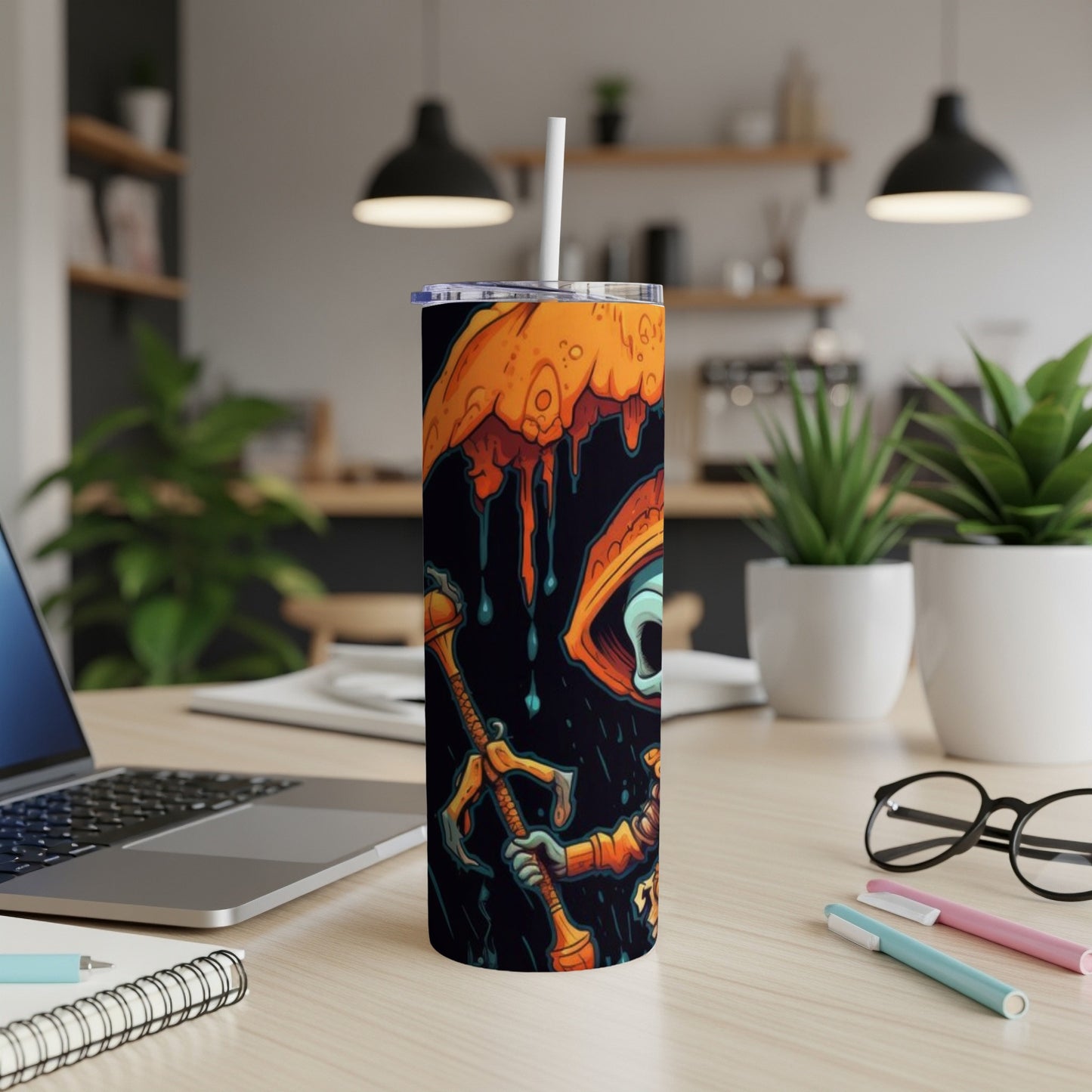 Tumbler with a cartoon monster design, an eye, and dripping orange elements.