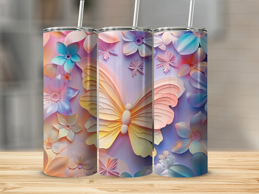 Three floral tumblers with a butterfly design on a wooden surface.