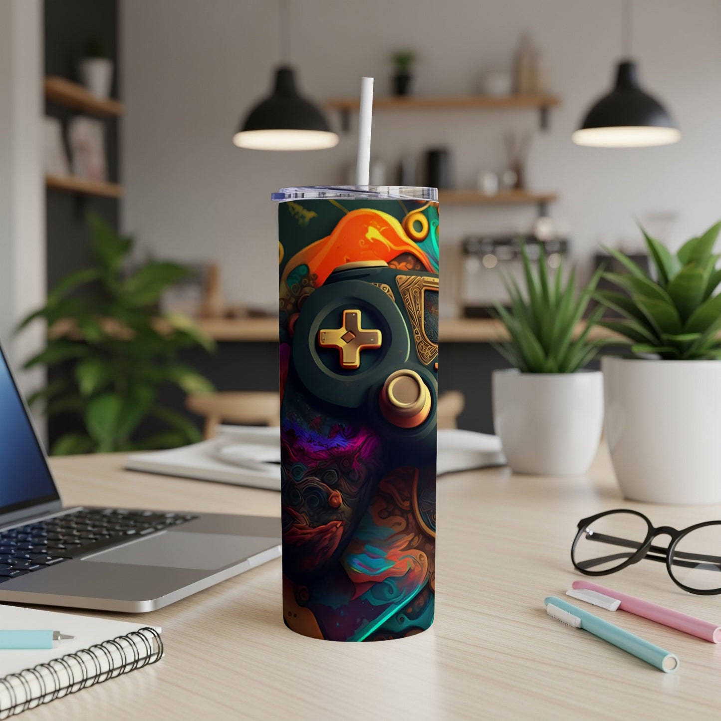 Gaming controller design on a skinny tumbler with a straw.