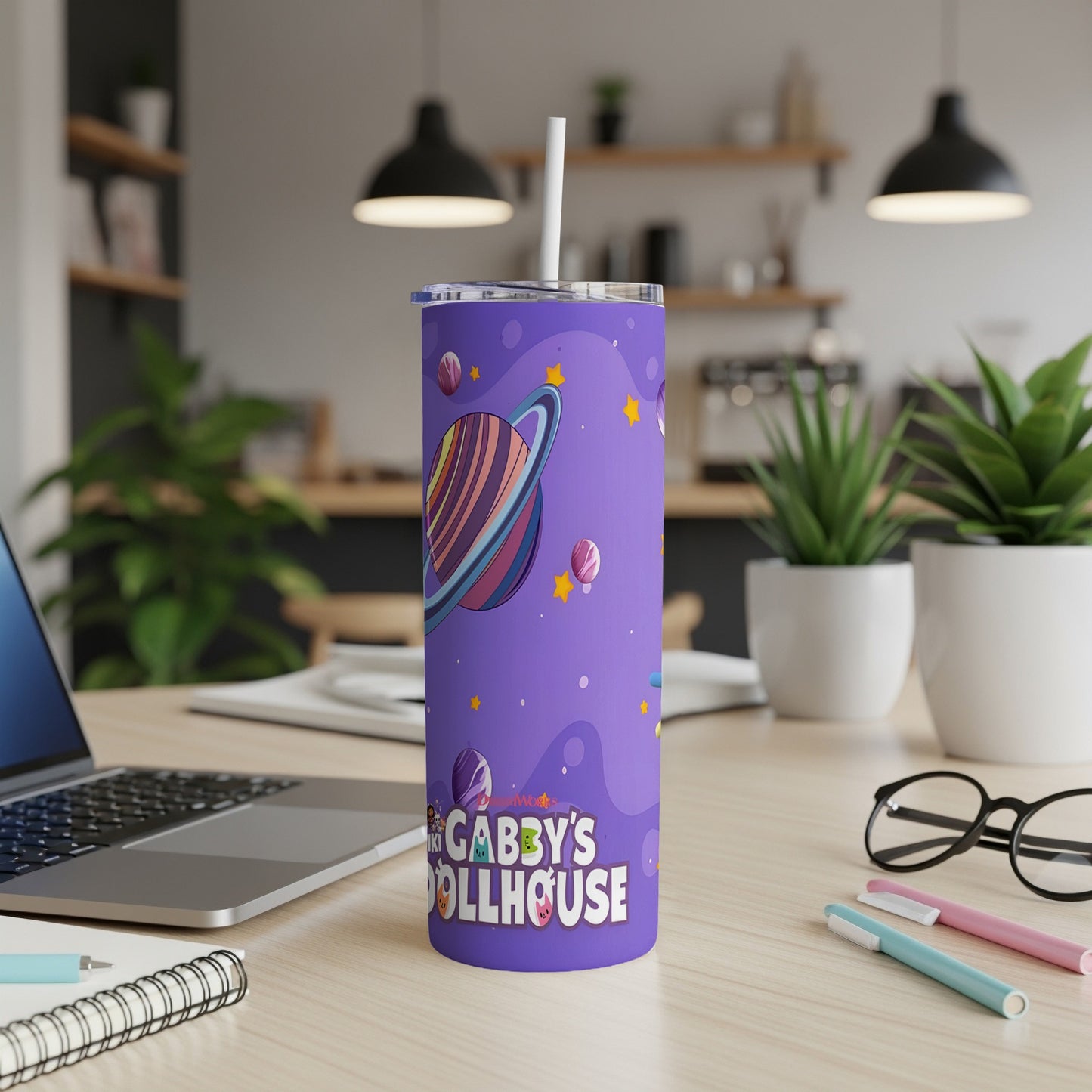 Purple tumbler with Gabby's Dollhouse characters and planets.