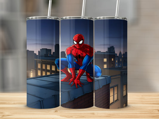 Spider-Man crouches on a rooftop with a city skyline at dusk.